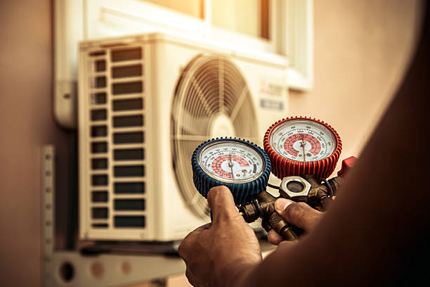 Professional Air Conditioning Service technician working in Graysville, AL